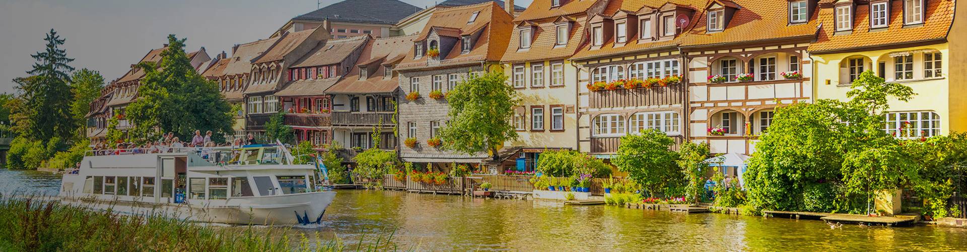 Small boat cruising along a German river, Germany